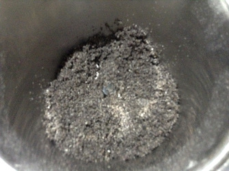 grinding roasted black til - sesame seeds