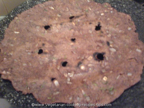 Ragi rotti - Finger millet bread turned to cook on other side