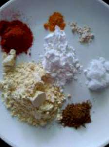 besan, rice flour, red chili powder, salt, hing, garam masala, turmeric powder